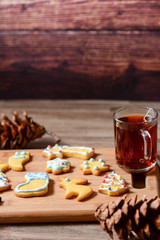 Christmas cookie on a wooden background.Tasty homemade Christmas cookies on wooden board, closeup view. Tasty colorful Christmas cookies. Vertical copy space