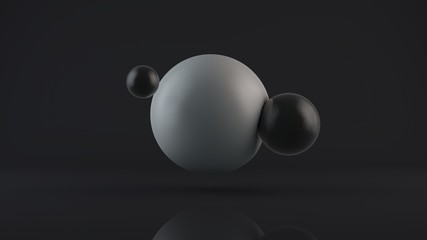 3D rendering of a large glowing white sphere and two black balls placed side by side. The objects are in a dark Studio. Abstract composition of ideal figures, a combination of white and black.