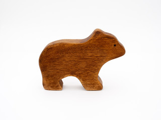 Toy Bear made of textured wood on white background