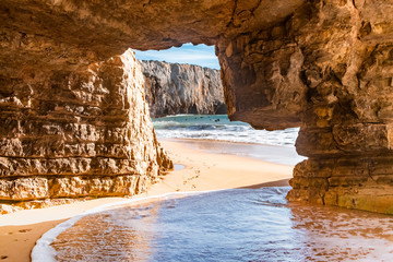 Rock natural cave at the surfers beach Praia do Beliche near Cabo San Vincente, Algarve, Portugal, Europe