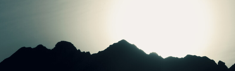 Panorama of the mountains at sunset. Beautiful landscape