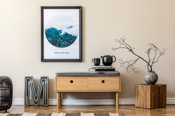 Design scandinavian home interior of living room with wooden commode, modern neon, rattan pouf, vase with flowers, tea pot and elegant accessories. Stylish home decor. Template. Mock up poster frame. 