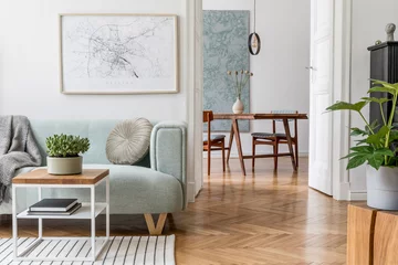 Foto op Canvas Stylish scandinavian living room with design mint sofa, furnitures, mock up poster map, plants and elegant personal accessories. Modern home decor. Open space with dining room. Template Ready to use.  © FollowTheFlow