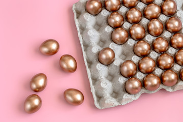 Background with Easter eggs in gold color.