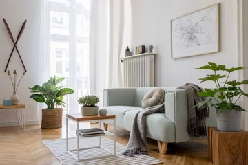 Foto op Canvas Stylish scandinavian living room with design mint sofa, furnitures, mock up poster map, plants and elegant personal accessories. Modern home decor. Bright and sunny room. Template Ready to use.  © FollowTheFlow