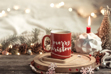 Festive background with a Cup and the inscription merry Christmas.