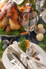 Festive turkey, on a served table, vertical frame