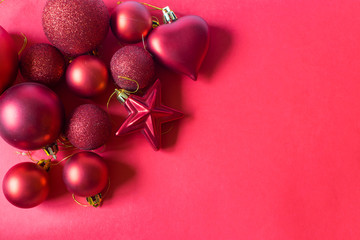 Group of beautiful red baubles on red background