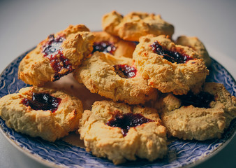 A blue plate of homemade jam buns