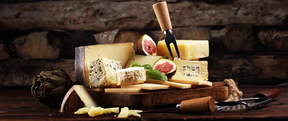 Fotobehang Different sorts of cheese. Cheese platter with different cheese and spice © beats_