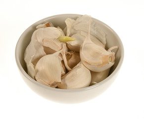 Garlic in a bowl isolated on white