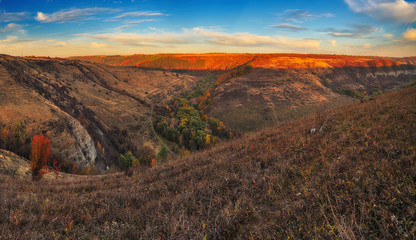 autumn evening. beautiful sunset in a picturesque place. dramatic sky over the canyon