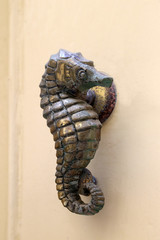 Decorative handle for the front door made of bronze. Malta.