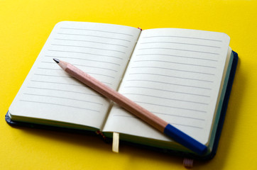 Notepad for notes is open on a blank page. Stationery, note paper.