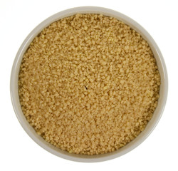 Couscous in a bowl isolated on white