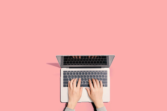 Person Using A Laptop Computer From Above