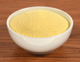 Semolina on wooden background