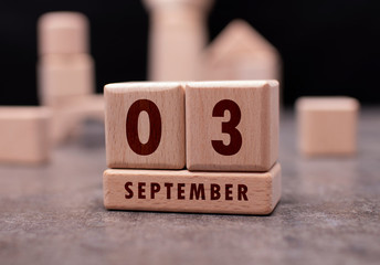 September 3 written with wooden blocks