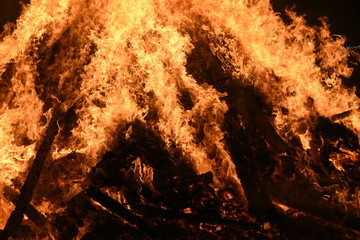 Big Bonfire by Night with Orange Glowing Flames