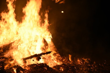 Big Bonfire by Night with Orange Glowing Flames