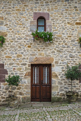 Santillana del Mar, a town in the Cantabria region of northern Spain. Detail of door and window.