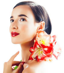 Fototapeta na wymiar young pretty brunette real woman with red flower amaryllis closeup isolated on white background. Fancy fashion makeup, bright lipstick, creative Ombre manicured nails
