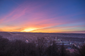 Sunset over a small european city in autumn