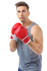Sporty male boxer on white background