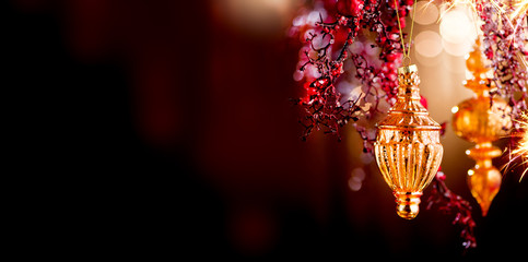 Christmas and New Year Golden Decoration. Abstract Blurred Bokeh Holiday Background with beautiful...