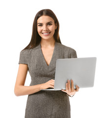 Beautiful young businesswoman with laptop on white background