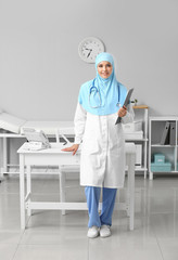 Female Muslim doctor in clinic