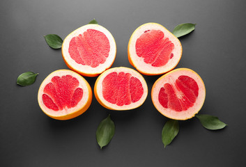 Fresh cut grapefruit on dark background