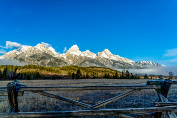 Split Rail Fence with Snow-Covered Mountains