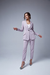 Beautiful sexy woman brunette hair glamour model wear pants and jacket suit work office style dress...