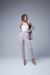 Beautiful sexy woman brunette hair glamour model wear pants and jacket suit work office style dress...