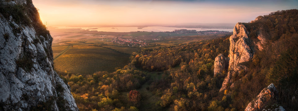 Colorful Autumn Sunset over Vineyards and Forest as Seen from Rocky Hill in Palava Protected Area near Mikulov in South Moravia, Czech Republic