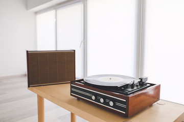 Fototapeta premium Record player on table near window