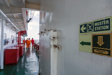 Corridor on starboard side of a construction work barge leading to muster asembly station 