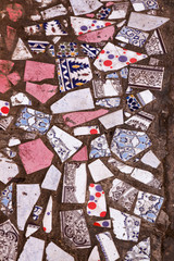 Broken tiles in a mosaic on the floor