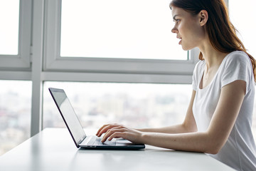 woman working on laptop at home