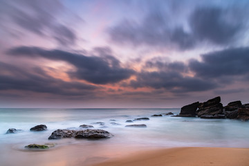 Obraz premium Soft Dawn Seascape with Smoky Haze and Clouds at the Seaside