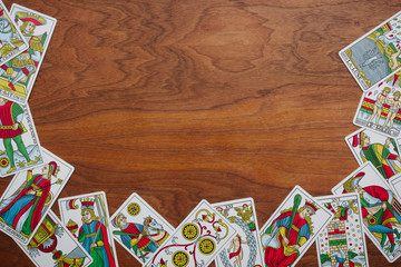 Tarot cards on a wooden background.