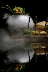 Beef tartare. Exquisite dish. Creative restaurant meal on black with reflection.