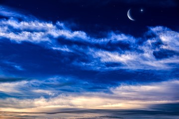 Fototapeta na wymiar Crescent moon with beautiful sunset background . Generous Ramadan . Religion background