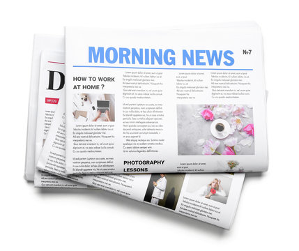 Morning newspapers on white background
