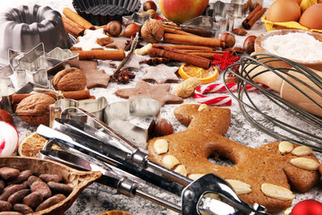 Christmas cookies and spices on rustic background with decoration