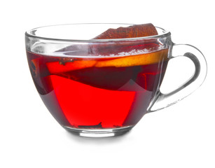 Glass cup of tasty mulled wine on white background