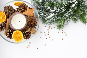 Christmas tree snow with candle and orange and cones and stars and little golden stars 