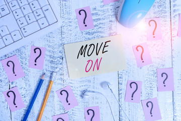 Word writing text Move On. Business photo showcasing to leave the place where you are staying and go somewhere else Writing tools, computer stuff and scribbled paper on top of wooden table