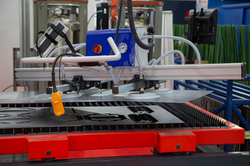 Mechanical vacuum metal sheet lifter loading to production line. Industrial metalworking machinery